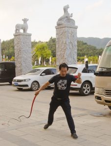 A whip lesson in front of the hotel, with Zhengzhou team trainer